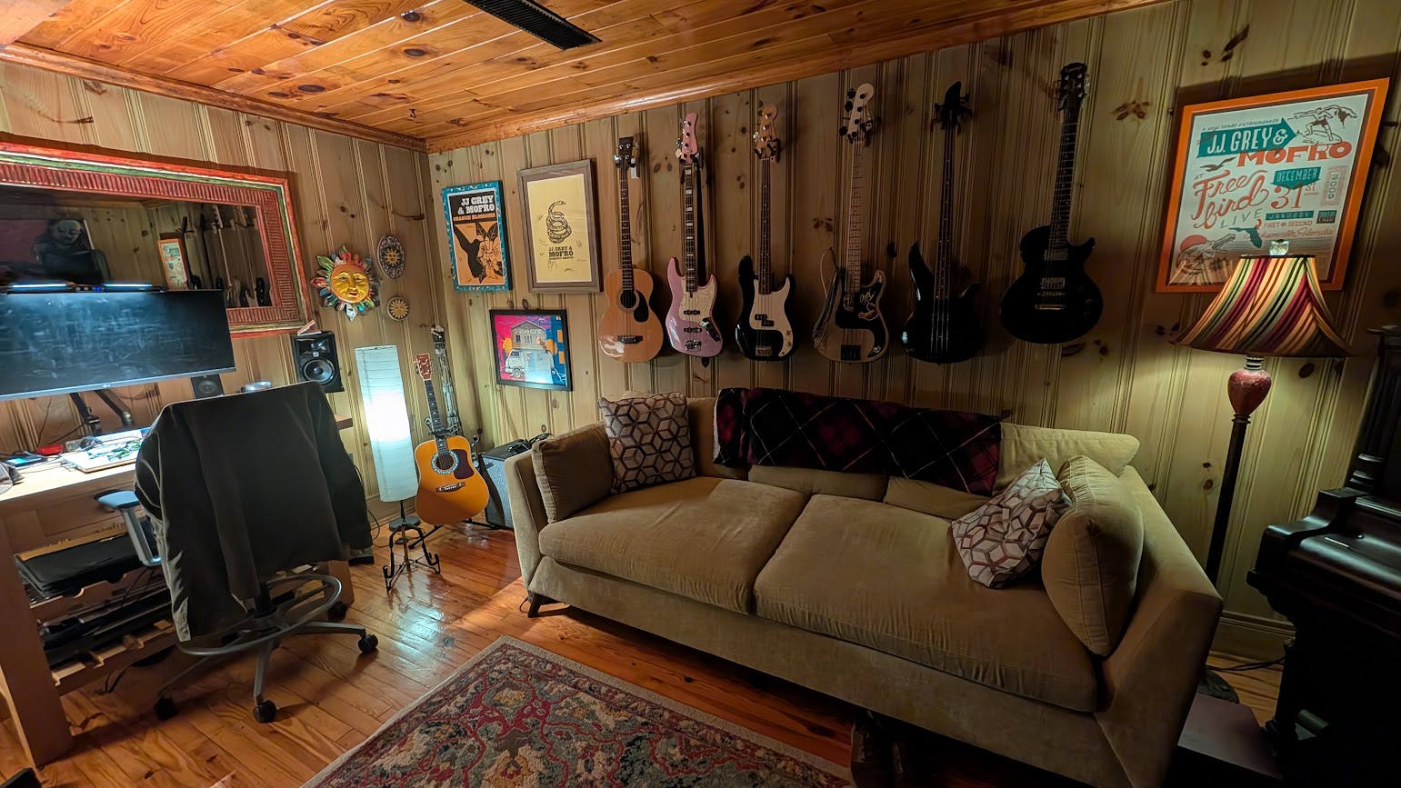 Guitars and a sofa in the studio room